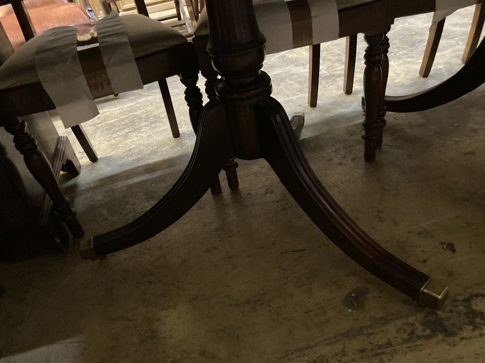 A George III design mahogany twin pillar extending dining table, 228cm extended (one spare leaf) width 99cm height 72cm